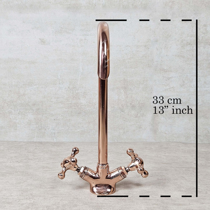 Rose gold faucet with measurement label on a light gray background