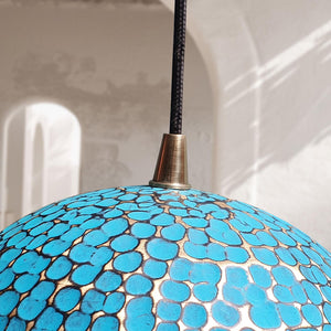 Blue mosaic pendant light with a textured surface