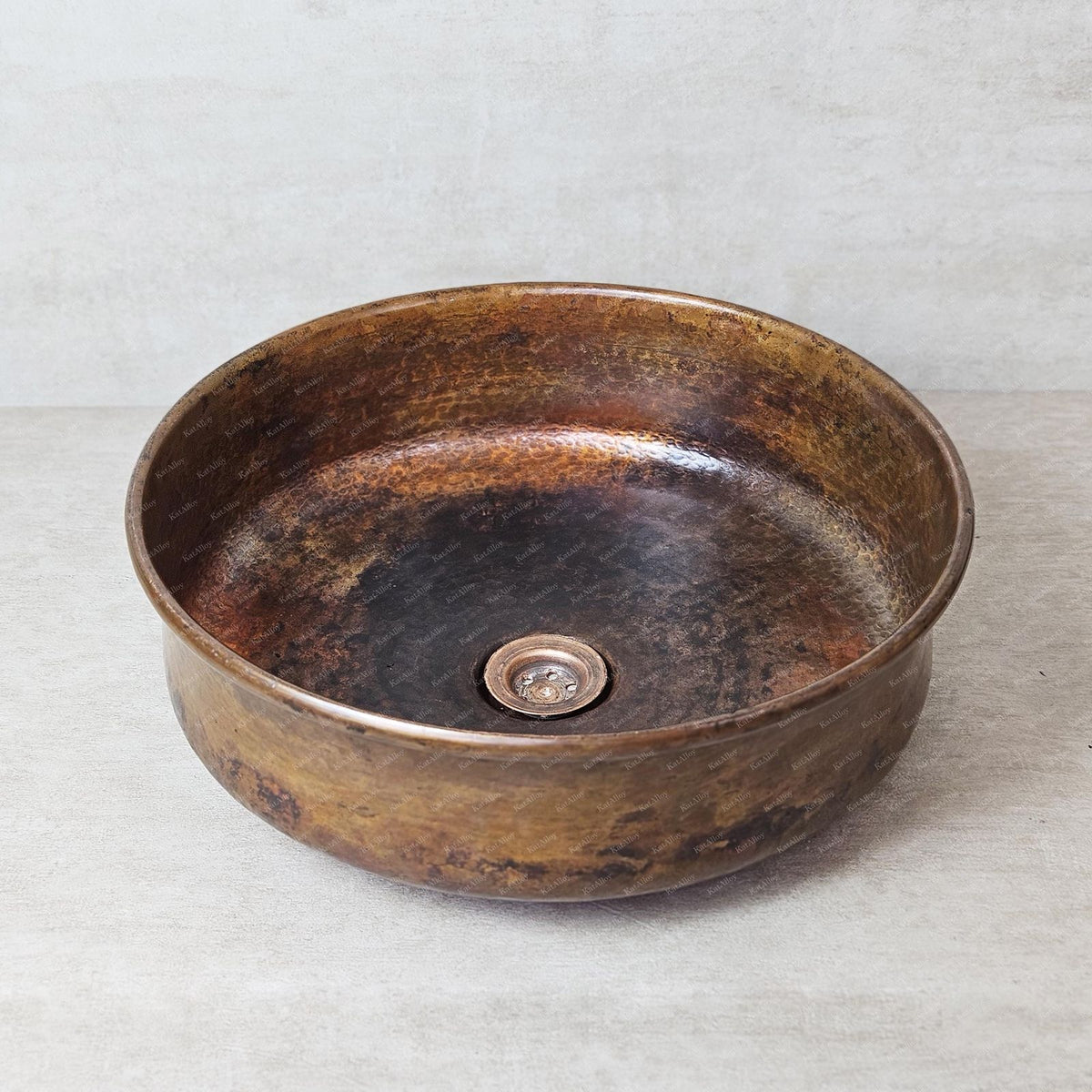 Copper sink on a light gray background