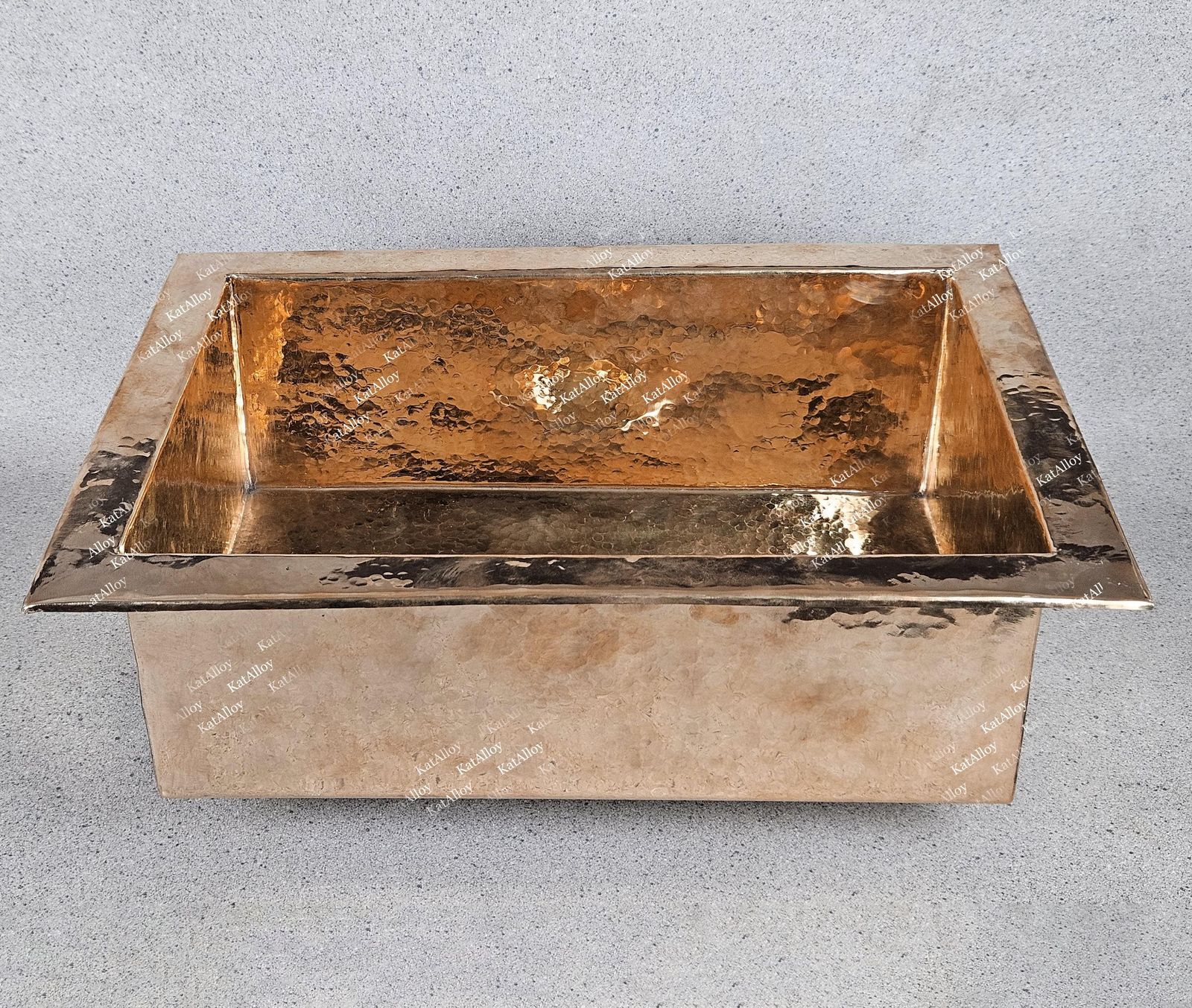 Copper sink on a gray background