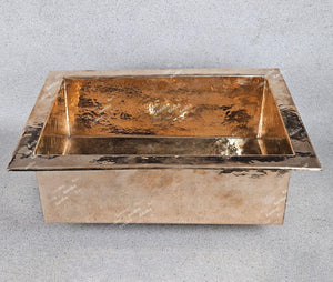 Copper sink on a gray background