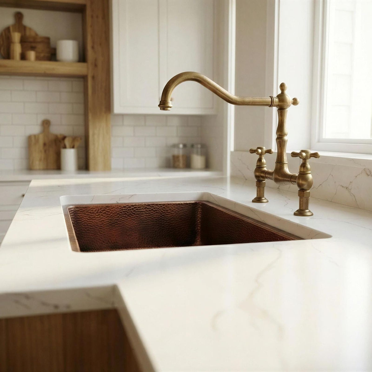 Kitchen with a copper sink and brass faucet