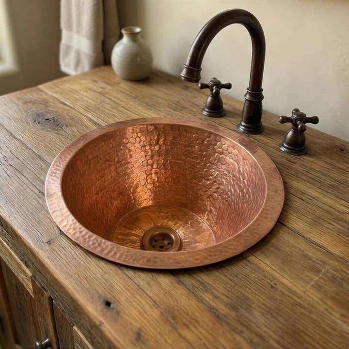 Copper sink on a wooden countertop with a faucet