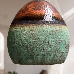 Decorative stone with gradient colors on a neutral background