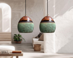 Two ceramic pendant lights hanging in a modern living room.