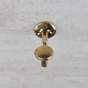Brass door handle on a textured gray background