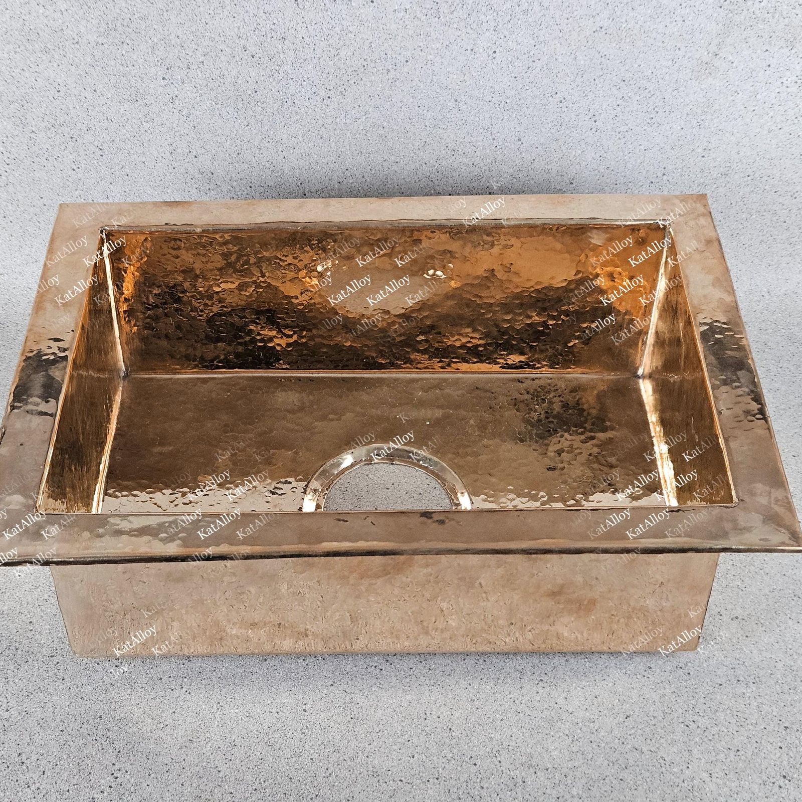 Copper sink on a gray background