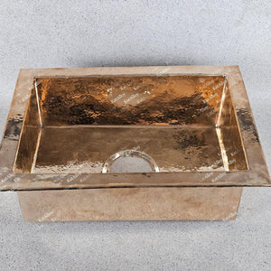 Copper sink on a gray background
