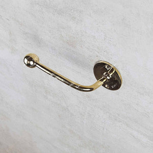 Gold door handle on a light gray background