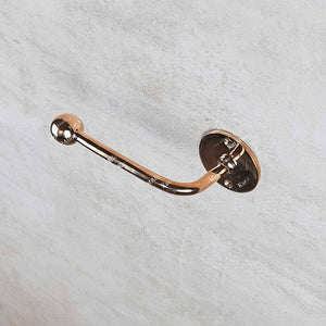 Rose gold towel hook on a light gray background