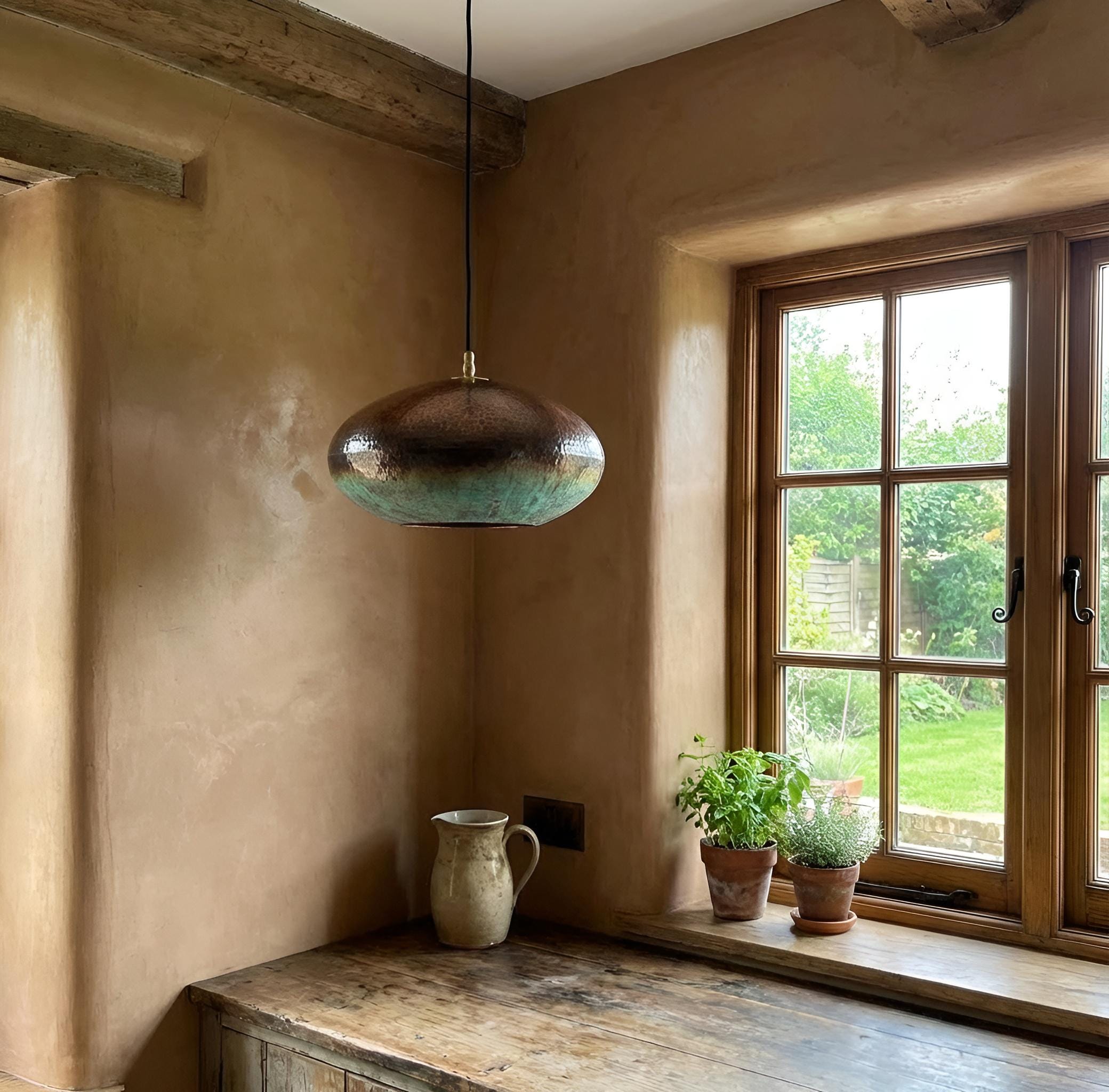 Nestled corner of a room with a pendant light, rustic wall, and window with outdoor view.