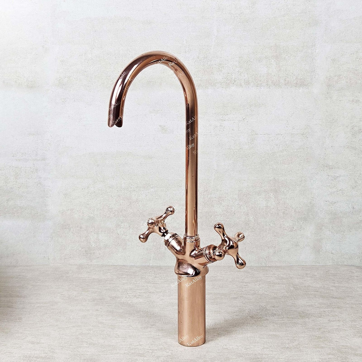 Rose gold kitchen faucet on a light gray background