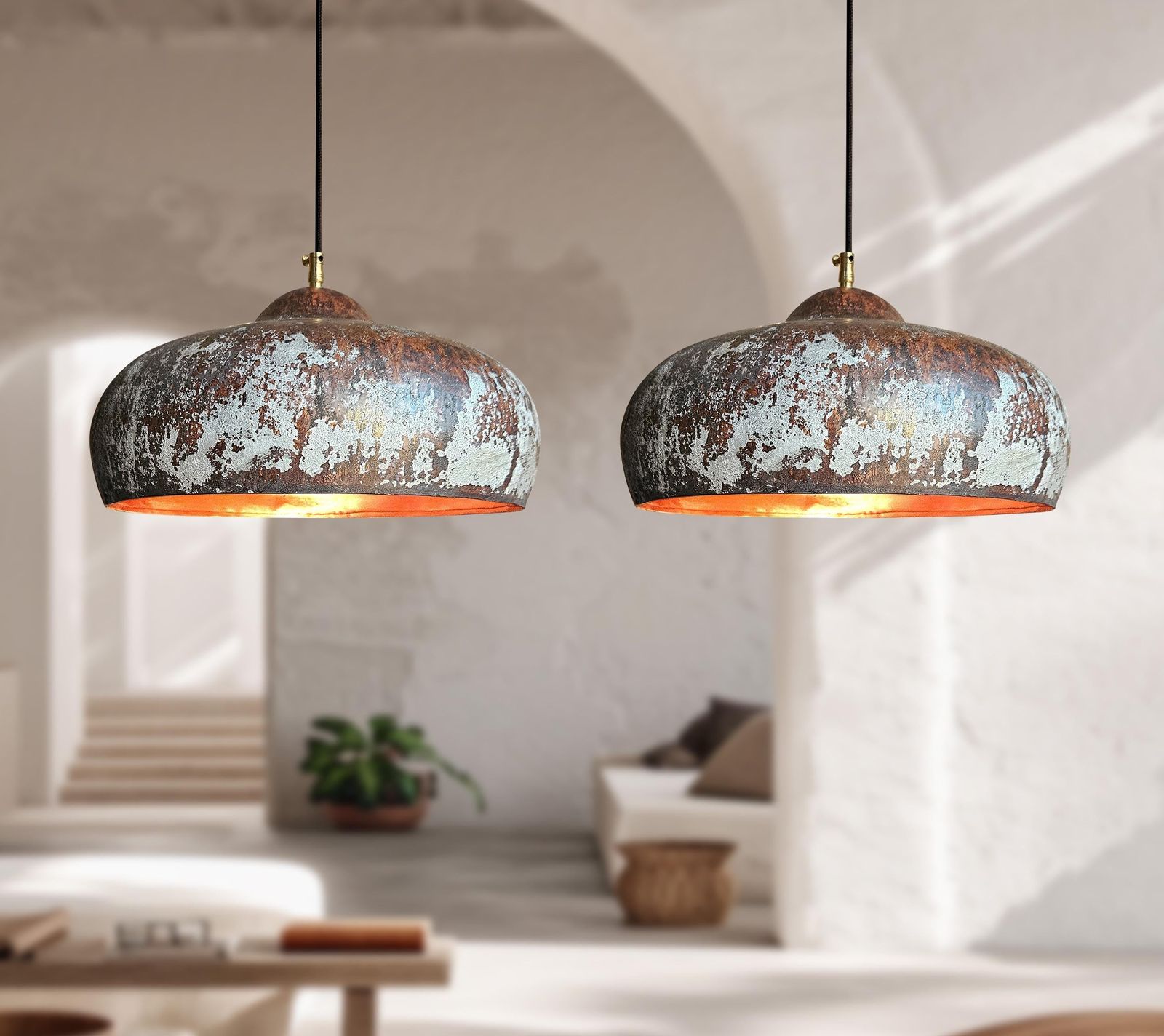 Two rustic pendant lights hanging in a modern living room.