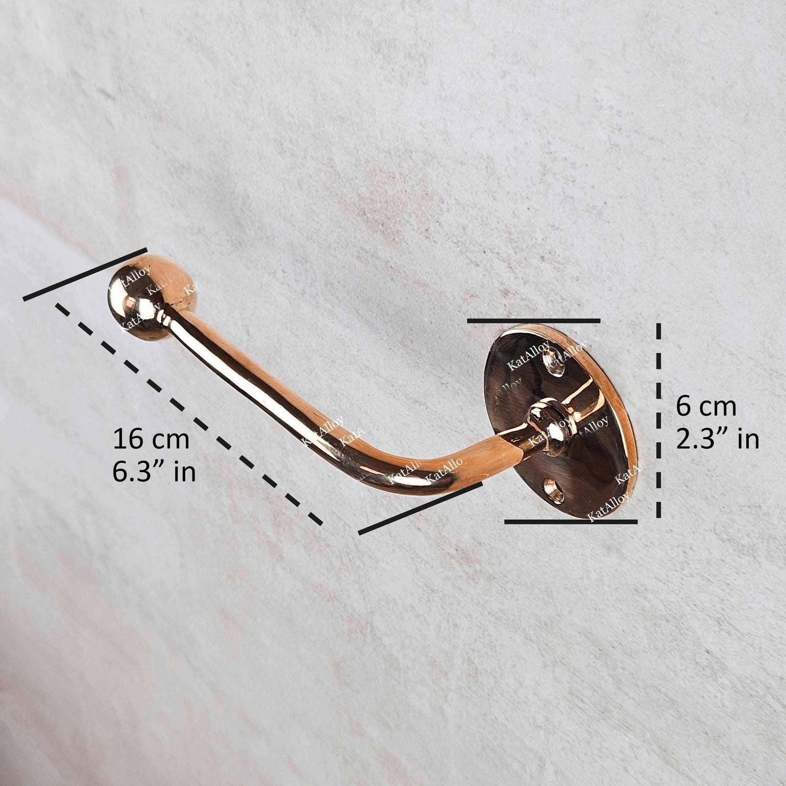 Rose gold handle with measurements on a white background
