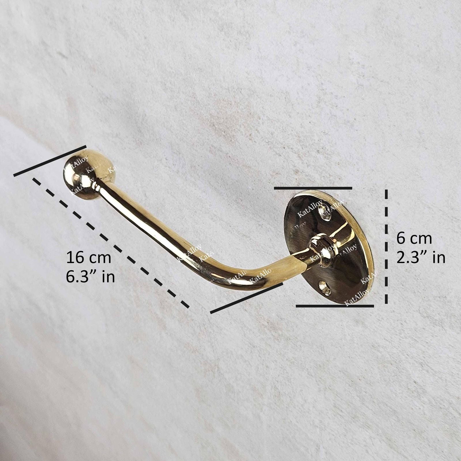 Gold towel hook with measurements on a white background