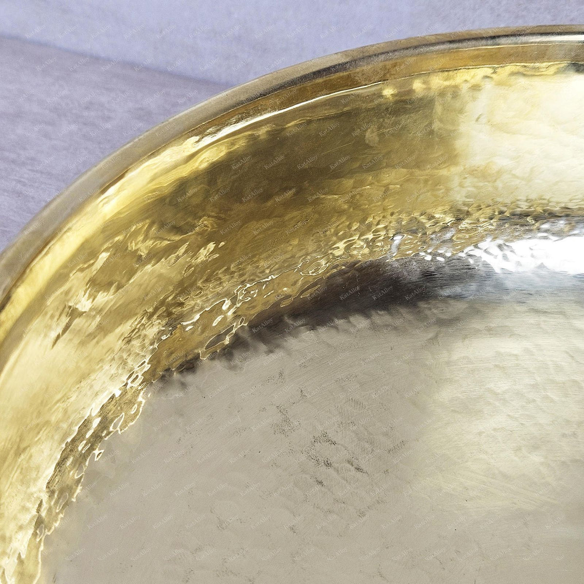 Gold decorative item on a textured surface
