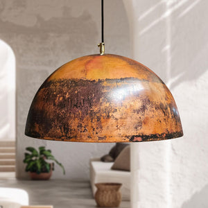 Vintage-style pendant light with a distressed finish in a room setting.