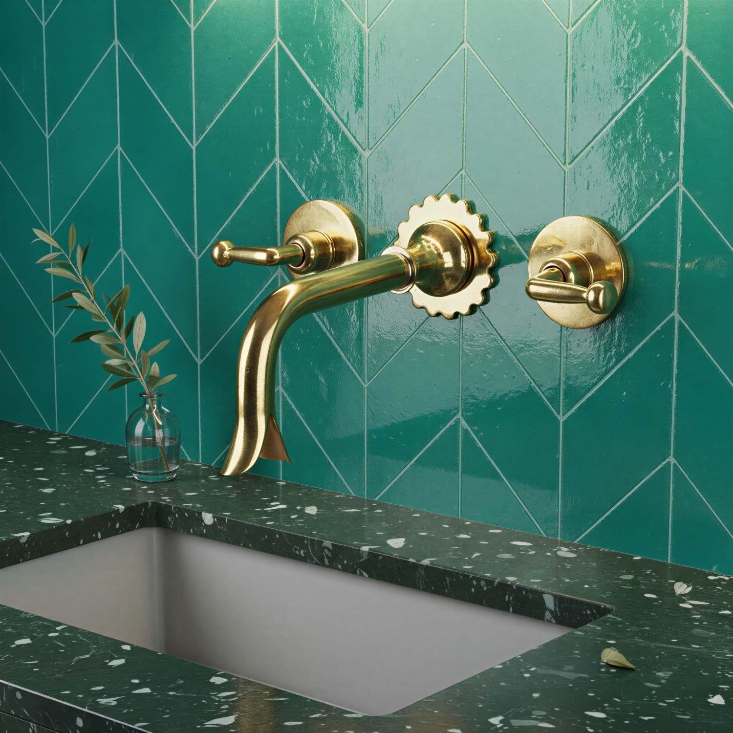Gold faucet and handles on a teal tiled wall with a green speckled countertop.