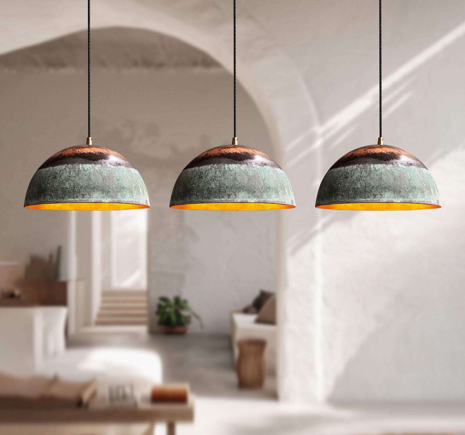 Three pendant lights hanging in a modern living room.