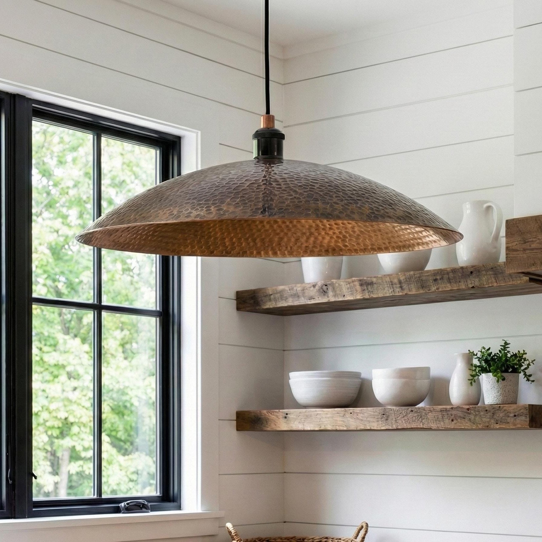 Kitchen with wooden pendant light and shelves, featuring a window and natural light.