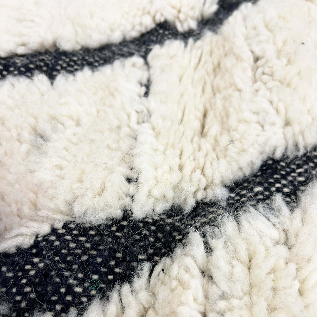 Ivory Black Maze Geometric Moroccan Wool Rug styled in a modern interior