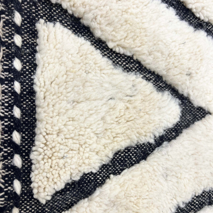 Handwoven wool texture of Ivory Black Maze Geometric Moroccan Wool Rug