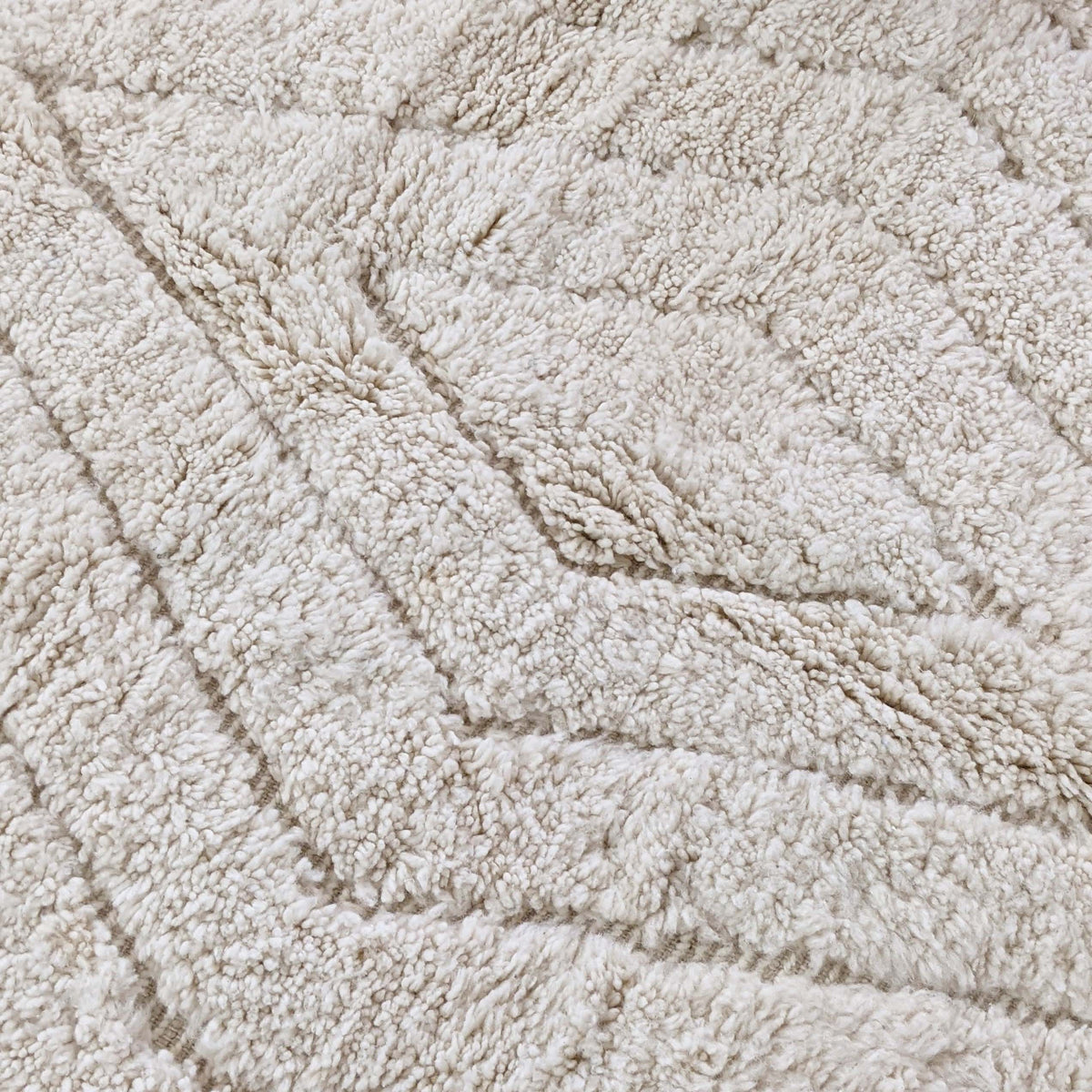 Full view of tonal ivory textured chevron Moroccan wool rug