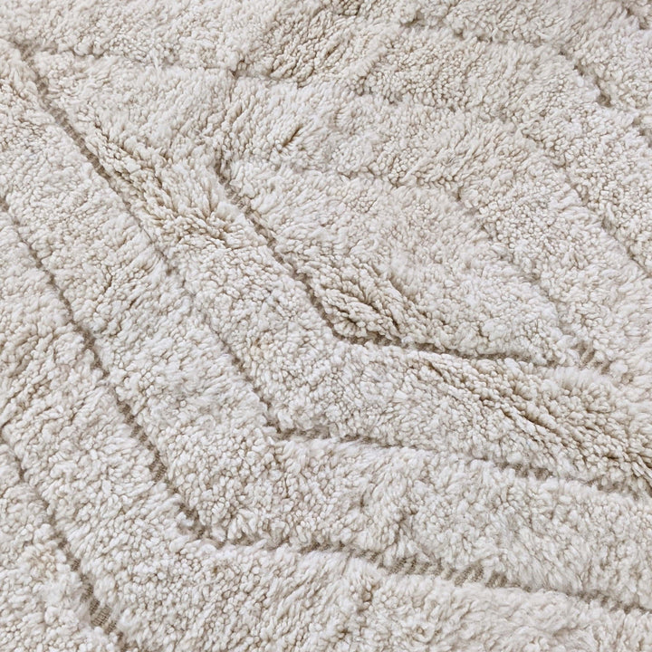 Full view of tonal ivory textured chevron Moroccan wool rug