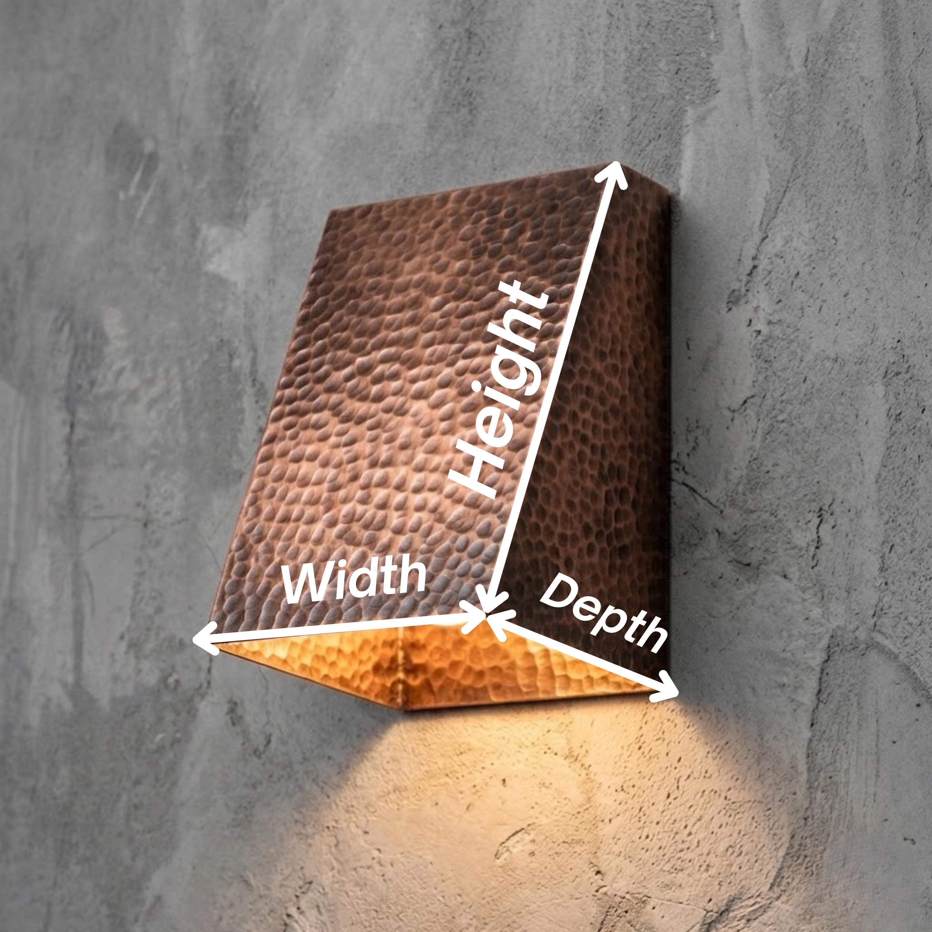 A wall-mounted rectangular light fixture with a hammered metallic finish, shown with white arrows and labels indicating width, height, and depth against a textured gray wall.