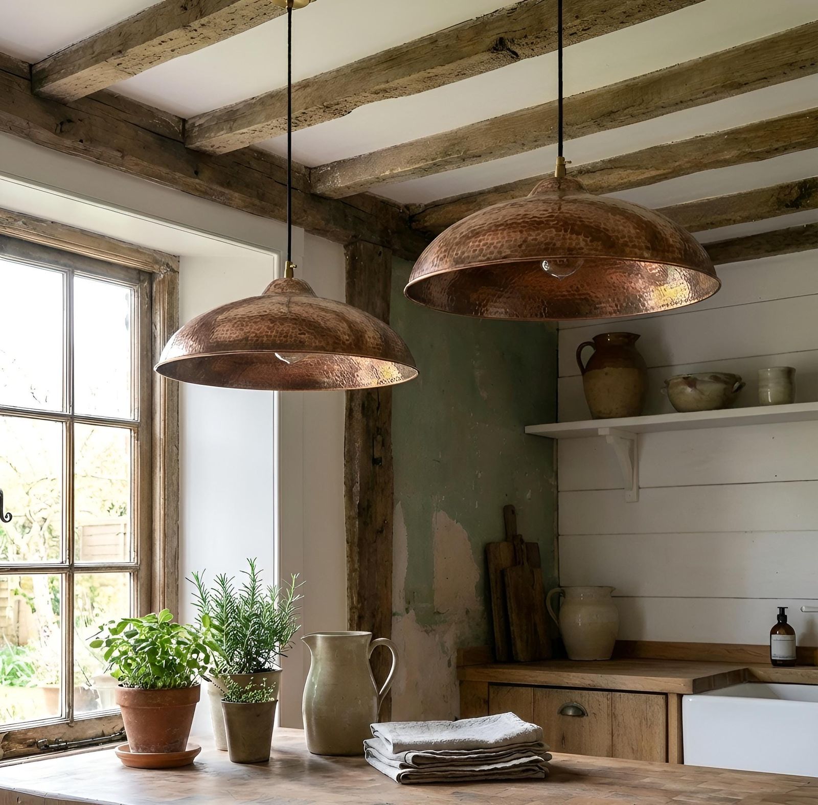 Kitchen with wooden pendant lights, plants, and a window.