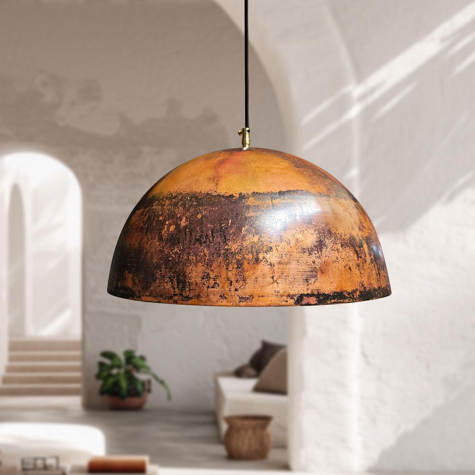 Vintage-style pendant light hanging in a modern interior setting